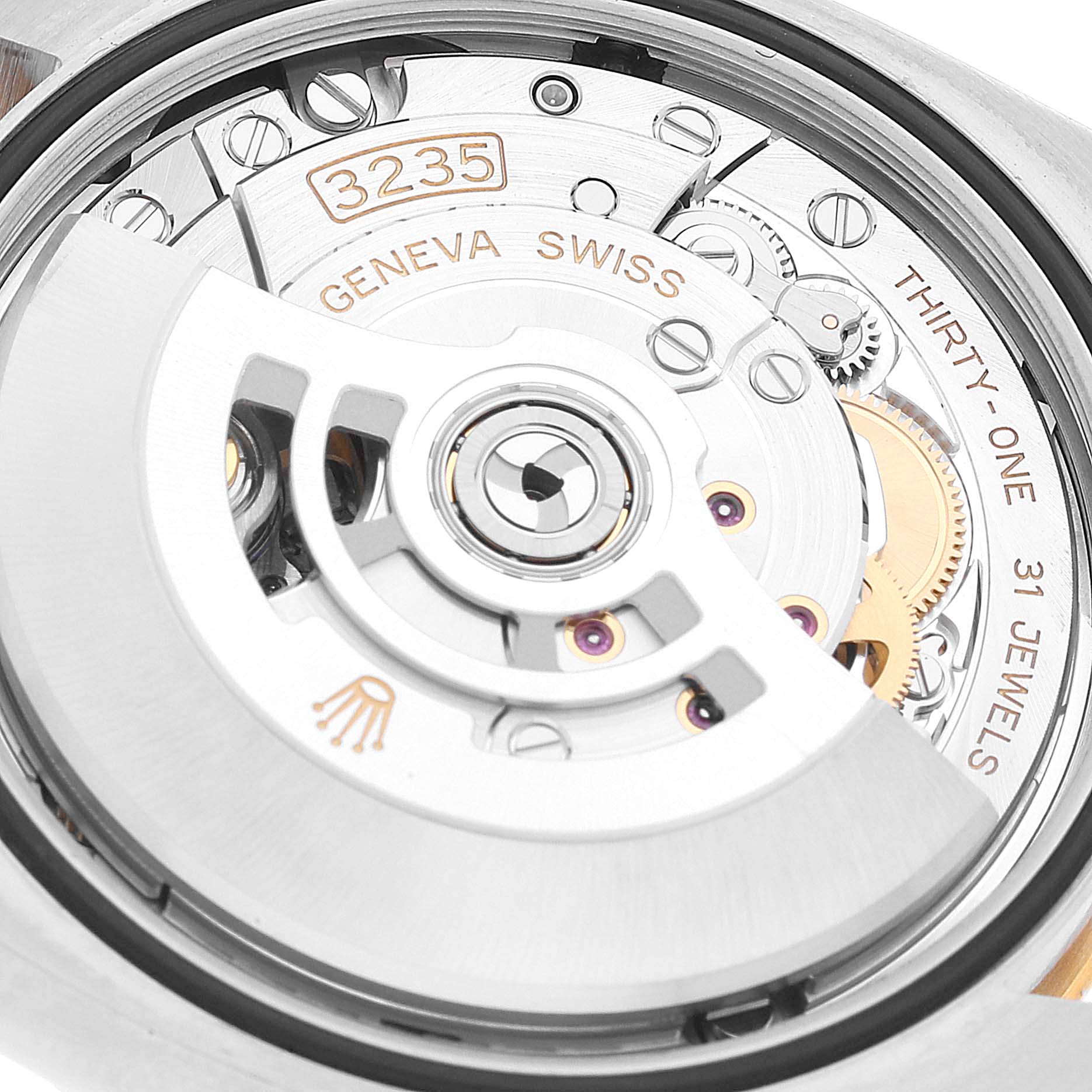 The image shows the movement and inner mechanism of a Rolex Datejust 126203 Men's Steel and Gold (two tone) White Dial 126203 Men's Steel and Gold (two tone) White Dial watch, highlighting the detailed engravings and components.