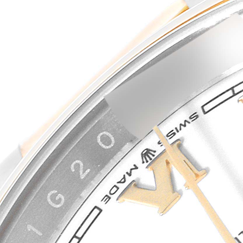 Close-up of the dial and rehaut of a Rolex Datejust 126203 Men's Steel and Gold (two tone) White Dial 126203 Men's Steel and Gold (two tone) White Dial, showing part of the "VI" marker and "Swiss Made" text.