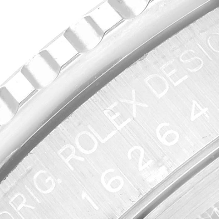 This close-up shows the engraved bezel and part of the inner case of a Rolex Turn-o-Graph 16264 Men's Stainless Steel Black Dial 16264 Men's Stainless Steel Black Dial watch.