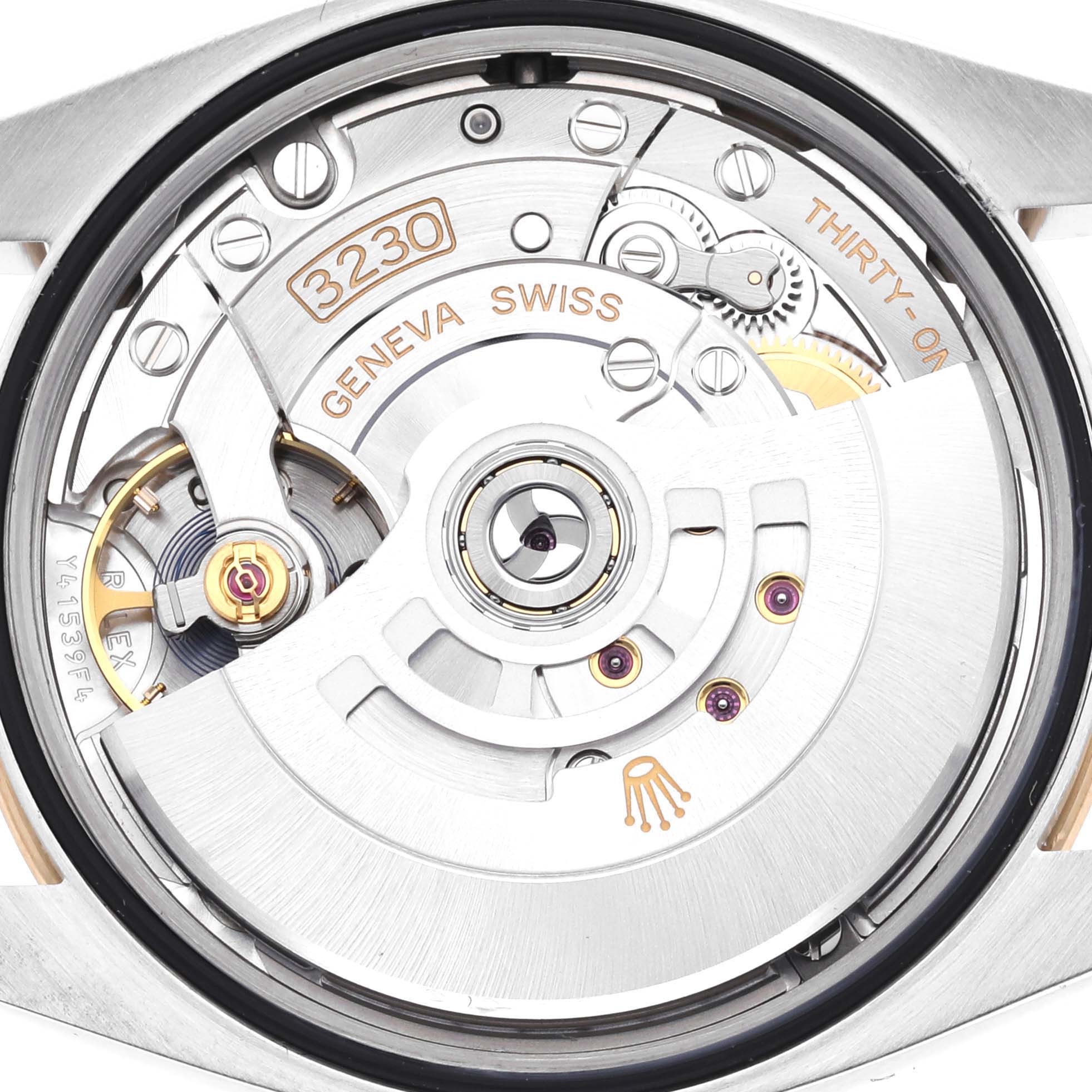 The image shows the back view of the Rolex Explorer 124273 Men's Steel and Gold (two tone) Black Dial 124273 Men's Steel and Gold (two tone) Black Dial, revealing its internal movement and mechanism.