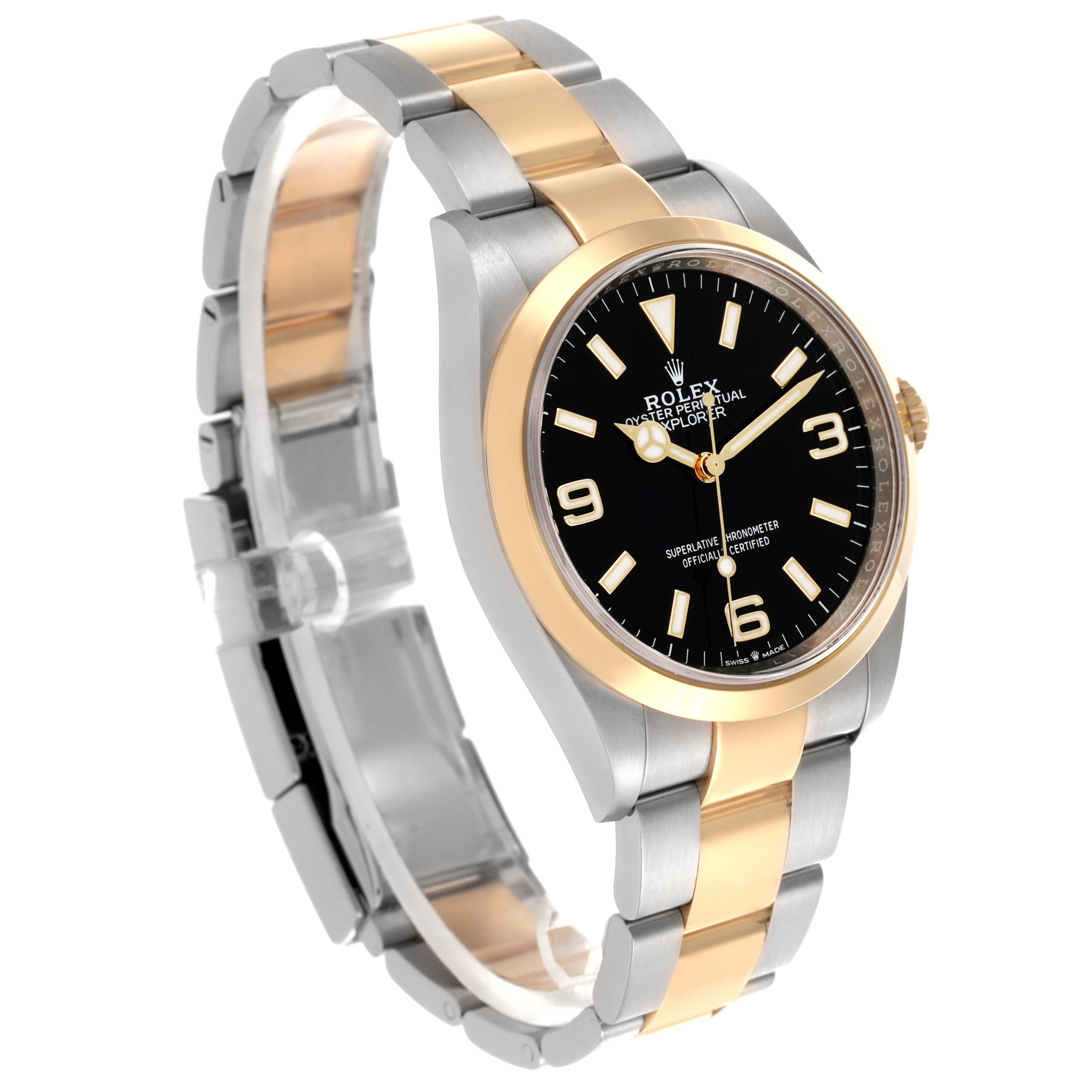 The Rolex Explorer 124273 Men's Steel and Gold (two tone) Black Dial 124273 Men's Steel and Gold (two tone) Black Dial watch is shown at a slight angle, highlighting its black dial, two-tone case, and bracelet.