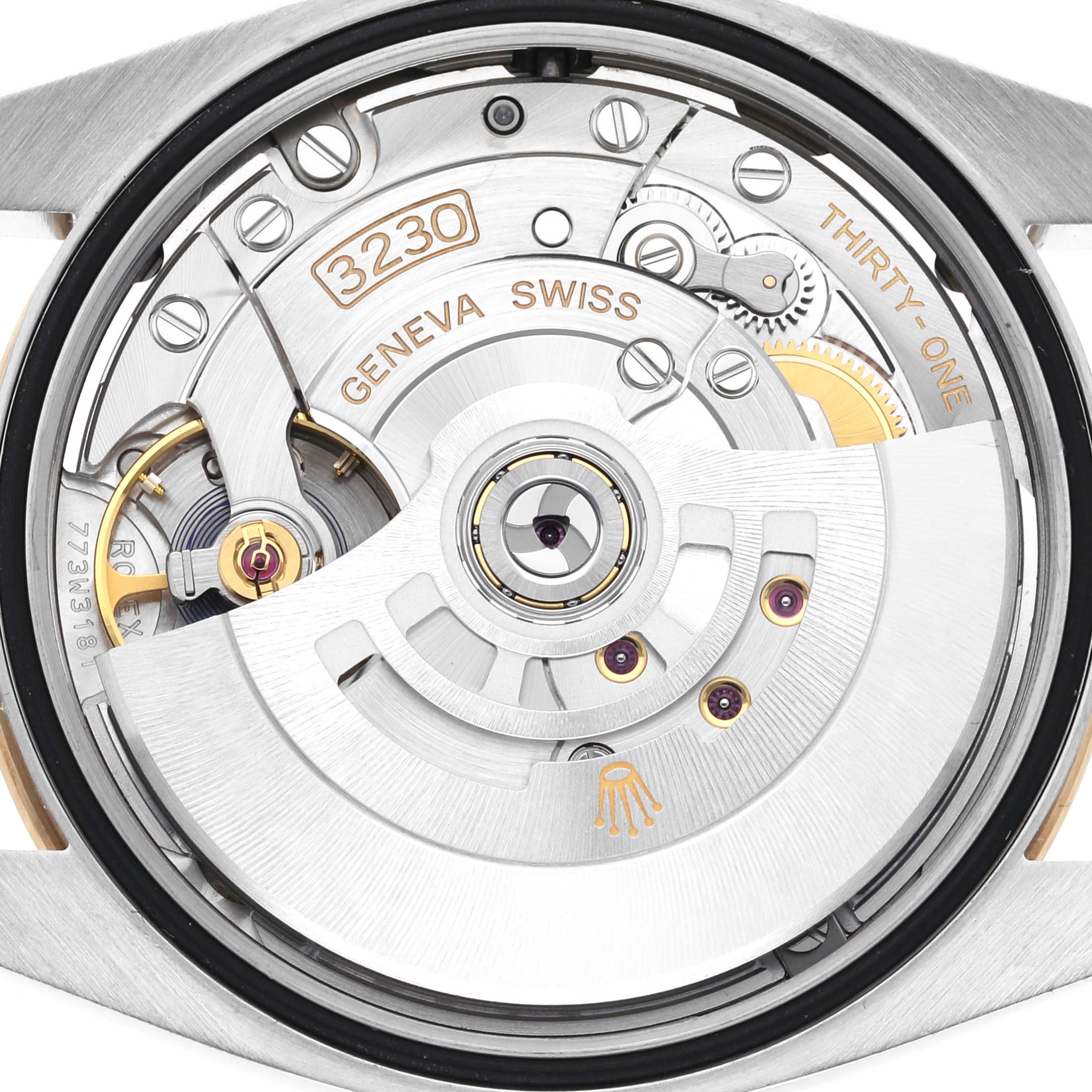 The image shows the movement of a Rolex Explorer 124273 Men's Steel and Gold (two tone) Black Dial 124273 Men's Steel and Gold (two tone) Black Dial watch from the back, highlighting the intricate mechanics and engravings.