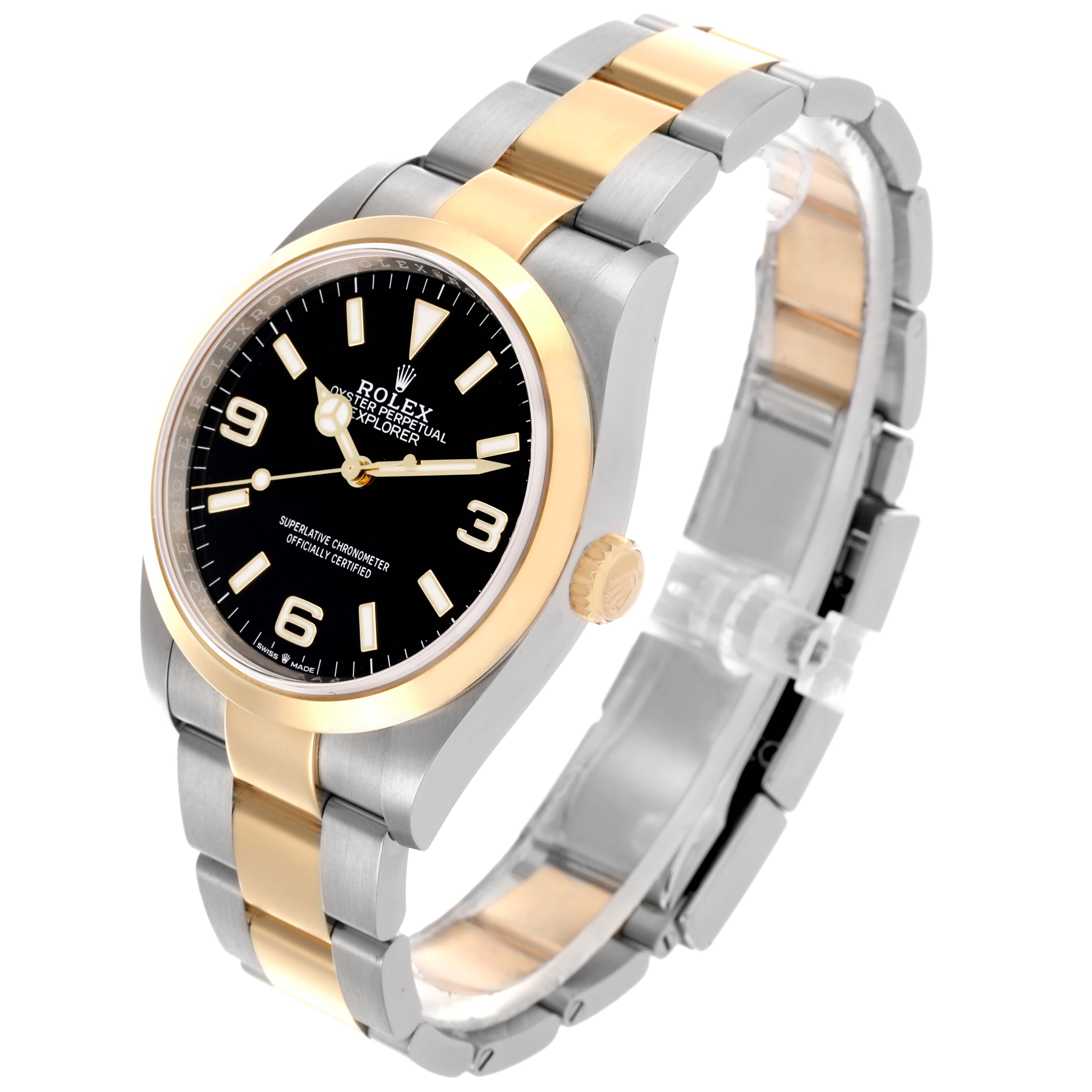 The Rolex Explorer 124273 Men's Steel and Gold (two tone) Black Dial 124273 Men's Steel and Gold (two tone) Black Dial watch is shown at a three-quarter angle, displaying the face, bezel, and two-tone bracelet.