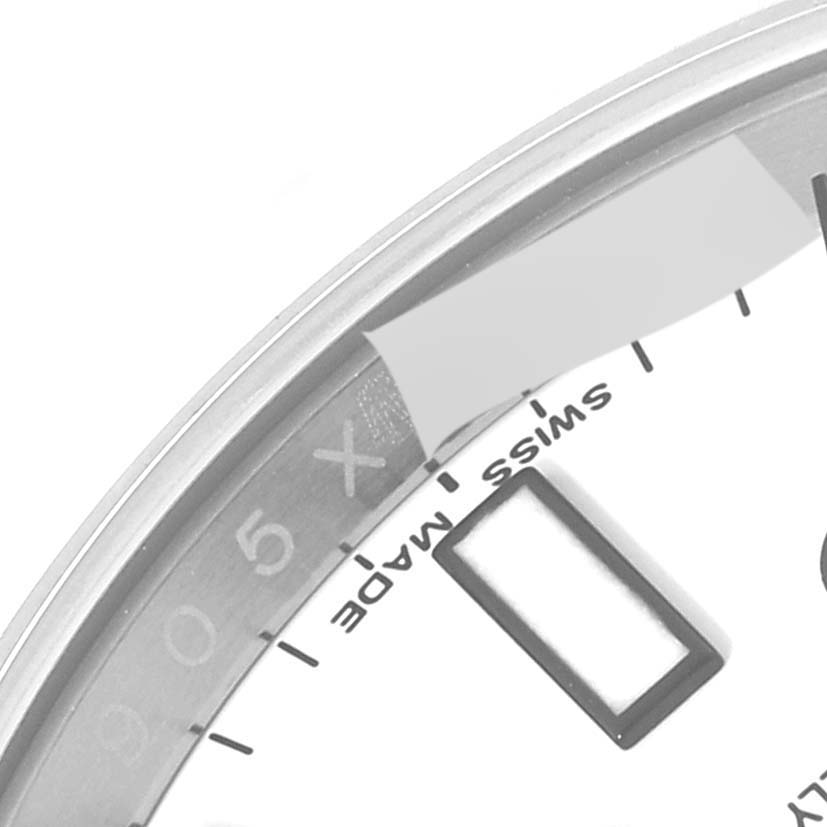 The image shows a close-up of the lower part of the dial of a Rolex Explorer 216570 Men
s Stainless Steel White Dial 216570 Men
s Stainless Steel White Dial, highlighting the "Swiss Made" text.