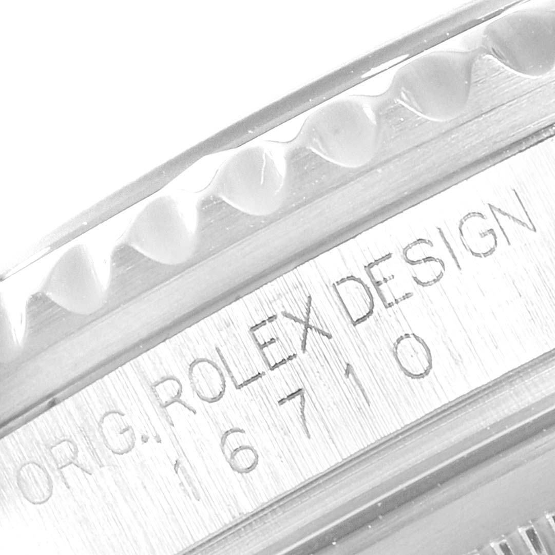 This close-up image shows the side view of the bezel and case with engravings of the Rolex GMT-Master 16710 Men's Stainless Steel Black Dial 16710 Men's Stainless Steel Black Dial model 16710.