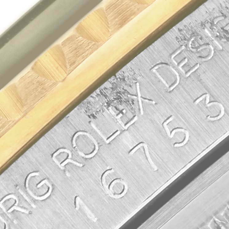 The image shows a close-up of the Rolex GMT-Master 16753 Men's Steel and Gold (two tone) Black Dial 16753 Men's Steel and Gold (two tone) Black Dial's engraved case side with model number and design details.