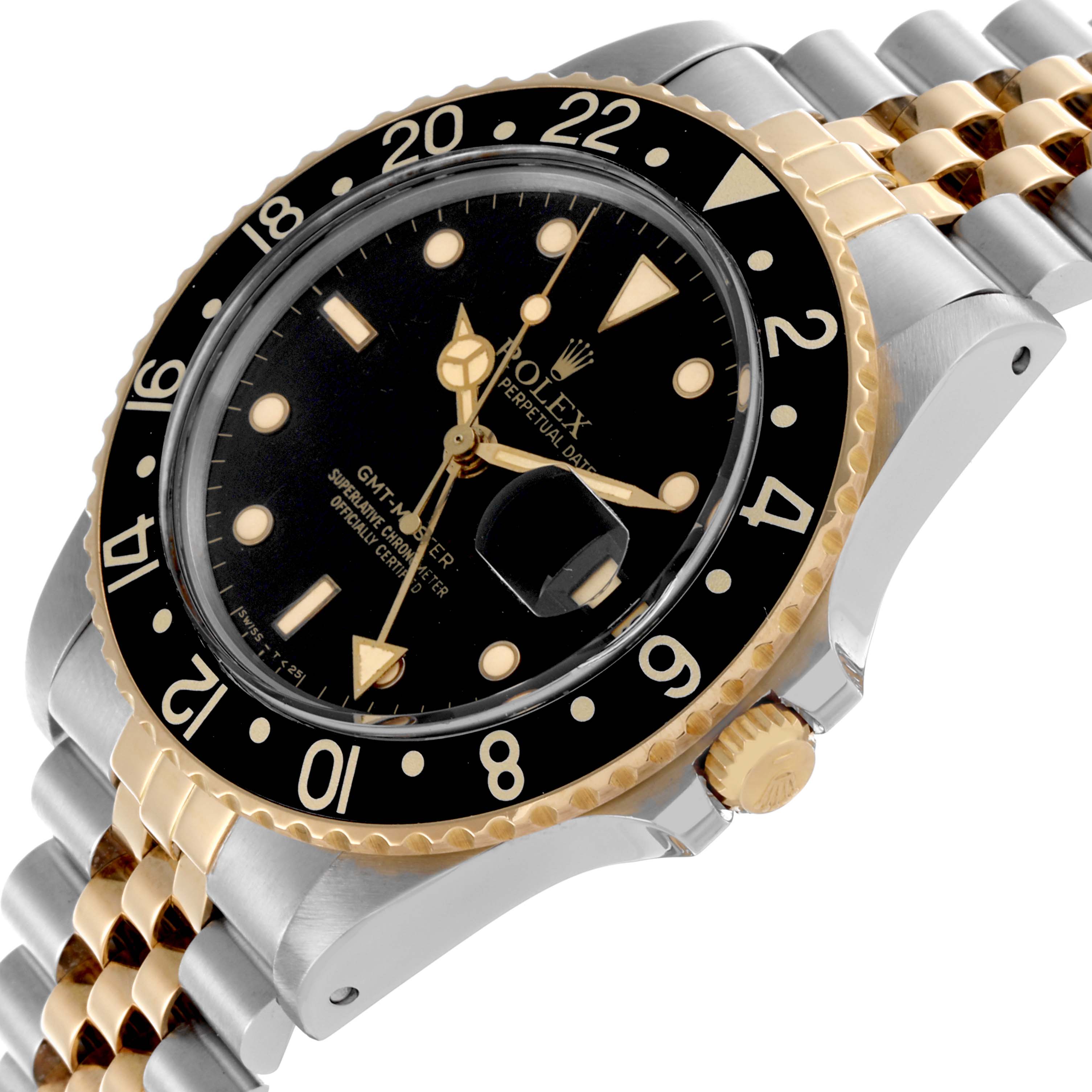 The image shows a Rolex GMT-Master 16753 Men's Steel and Gold (two tone) Black Dial 16753 Men's Steel and Gold (two tone) Black Dial watch at a slight angle, highlighting the bezel, crown, and two-tone bracelet.