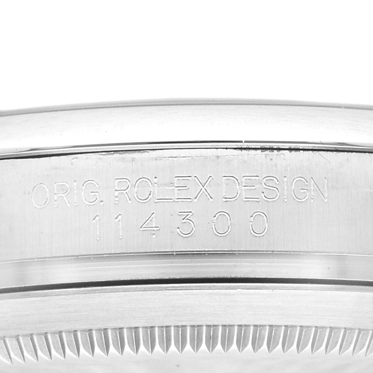 This image shows a close-up of the case back and edge detailing of a Rolex Oyster Perpetual 114300 Men's Stainless Steel Grey Dial 114300 Men's Stainless Steel Grey Dial 114300 watch.