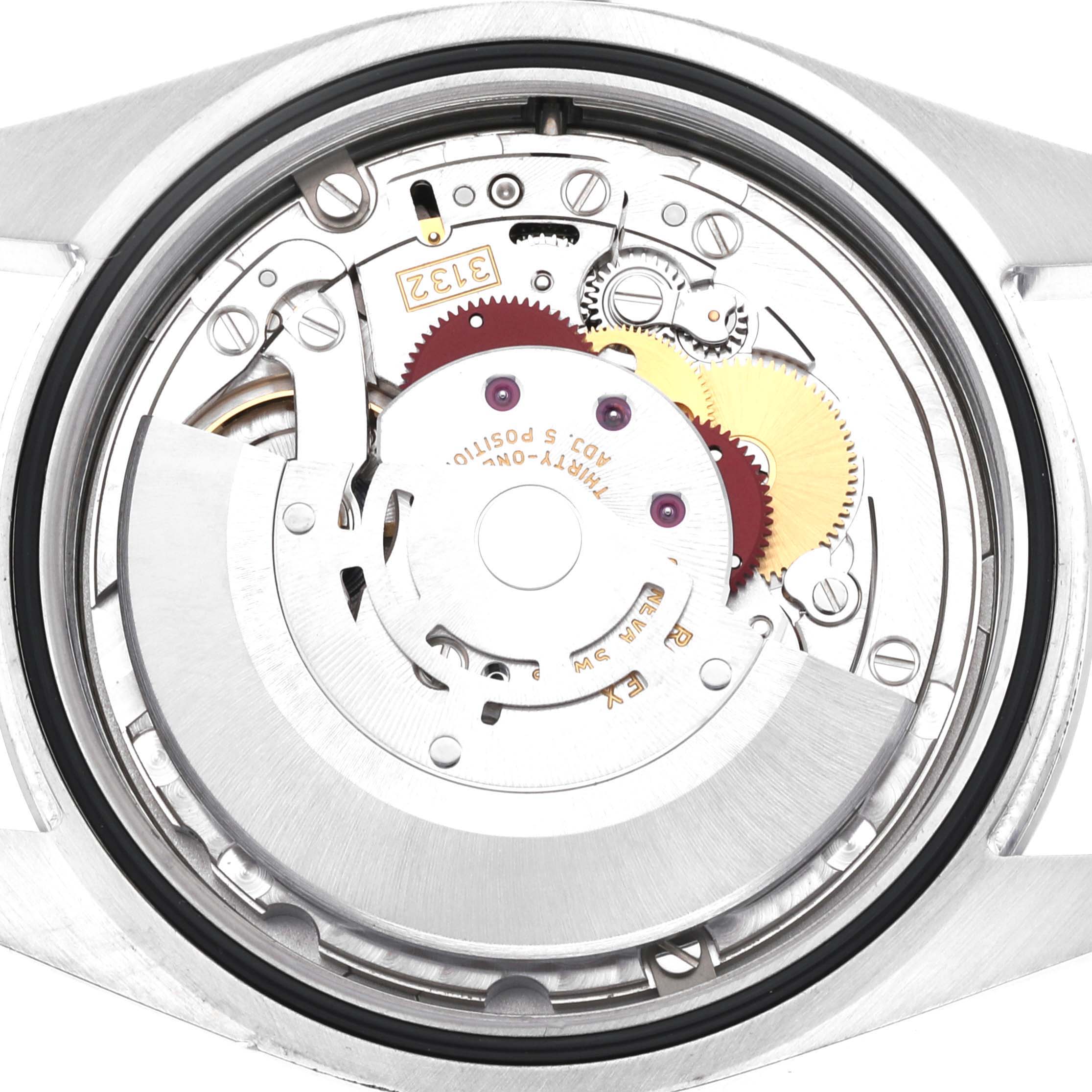 This image shows the inner mechanism of a Rolex Oyster Perpetual 114300 Men's Stainless Steel Grey Dial 114300 Men's Stainless Steel Grey Dial watch from a back view, revealing gears and components.