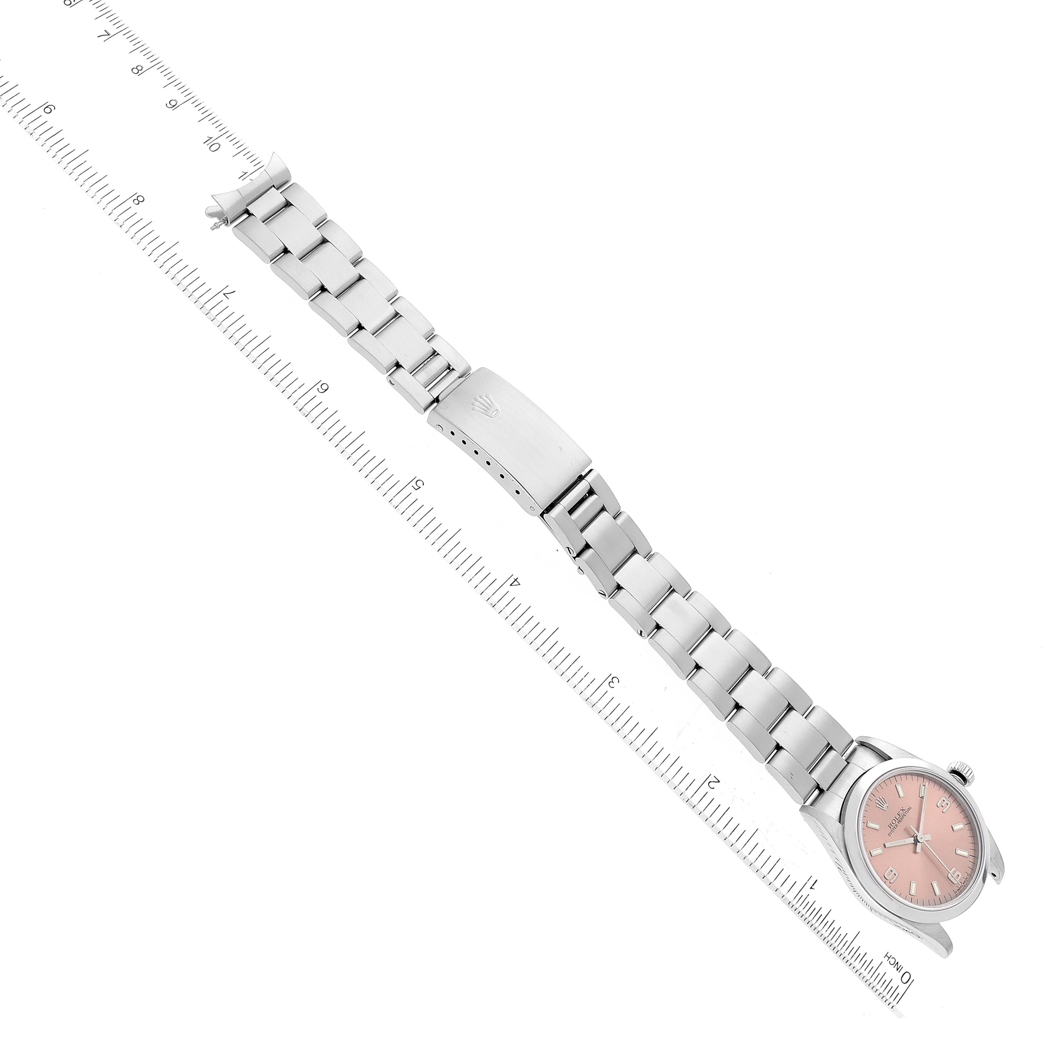 The image shows a Rolex Mid-Size 77080 Women's Stainless Steel Pink Dial 77080 Women's Stainless Steel Pink Dial model watch laid flat with its face and full bracelet visible, measured by a ruler.