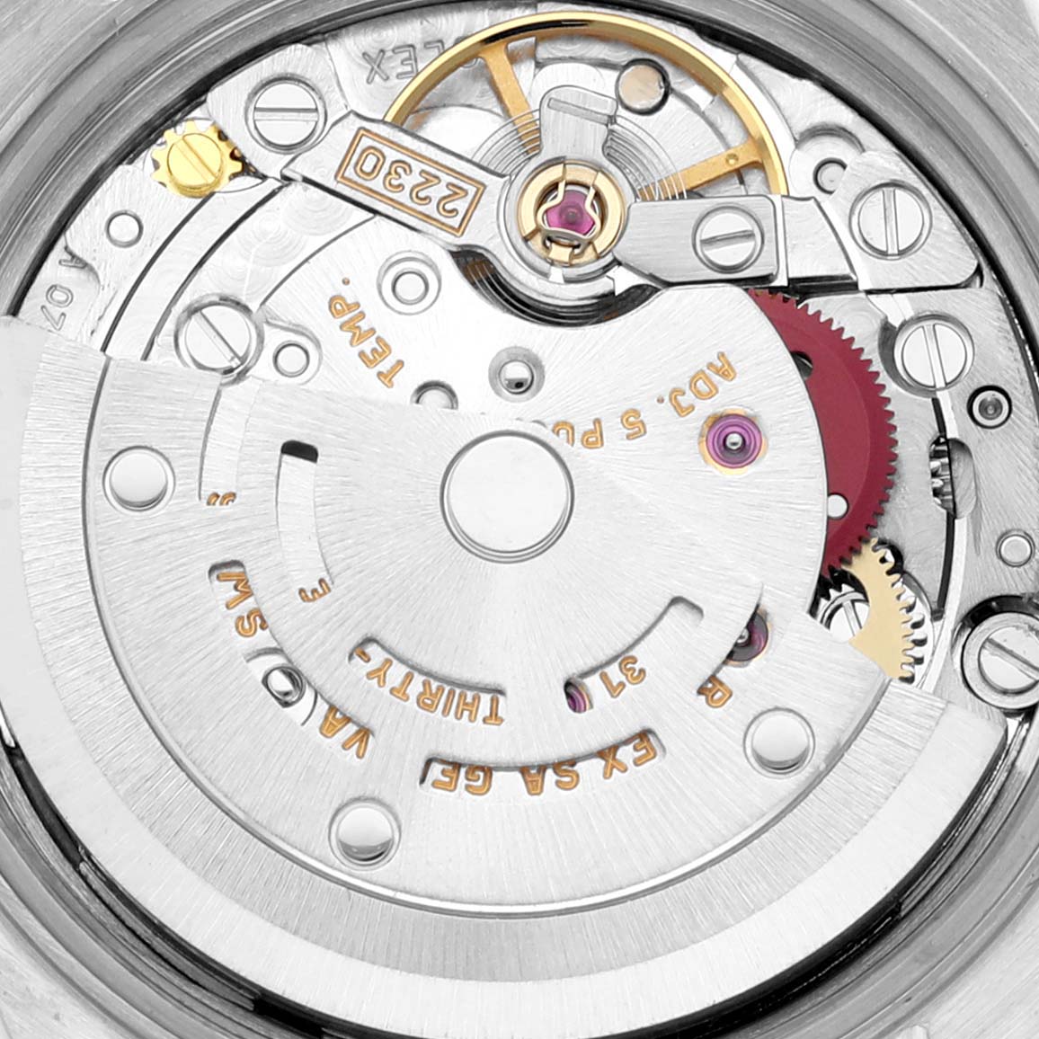This image shows the detailed inner mechanical movement of a Rolex Oyster Perpetual 76080 Women's Stainless Steel Silver Dial 76080 Women's Stainless Steel Silver Dial watch, displaying gears and components.