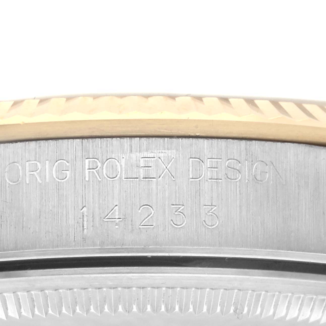 The image shows a close-up of the case edge of a Rolex Oyster Perpetual 14233 Men's Steel and Gold (two tone) Silver Dial 14233 Men's Steel and Gold (two tone) Silver Dial, highlighting the engraved design and model number.