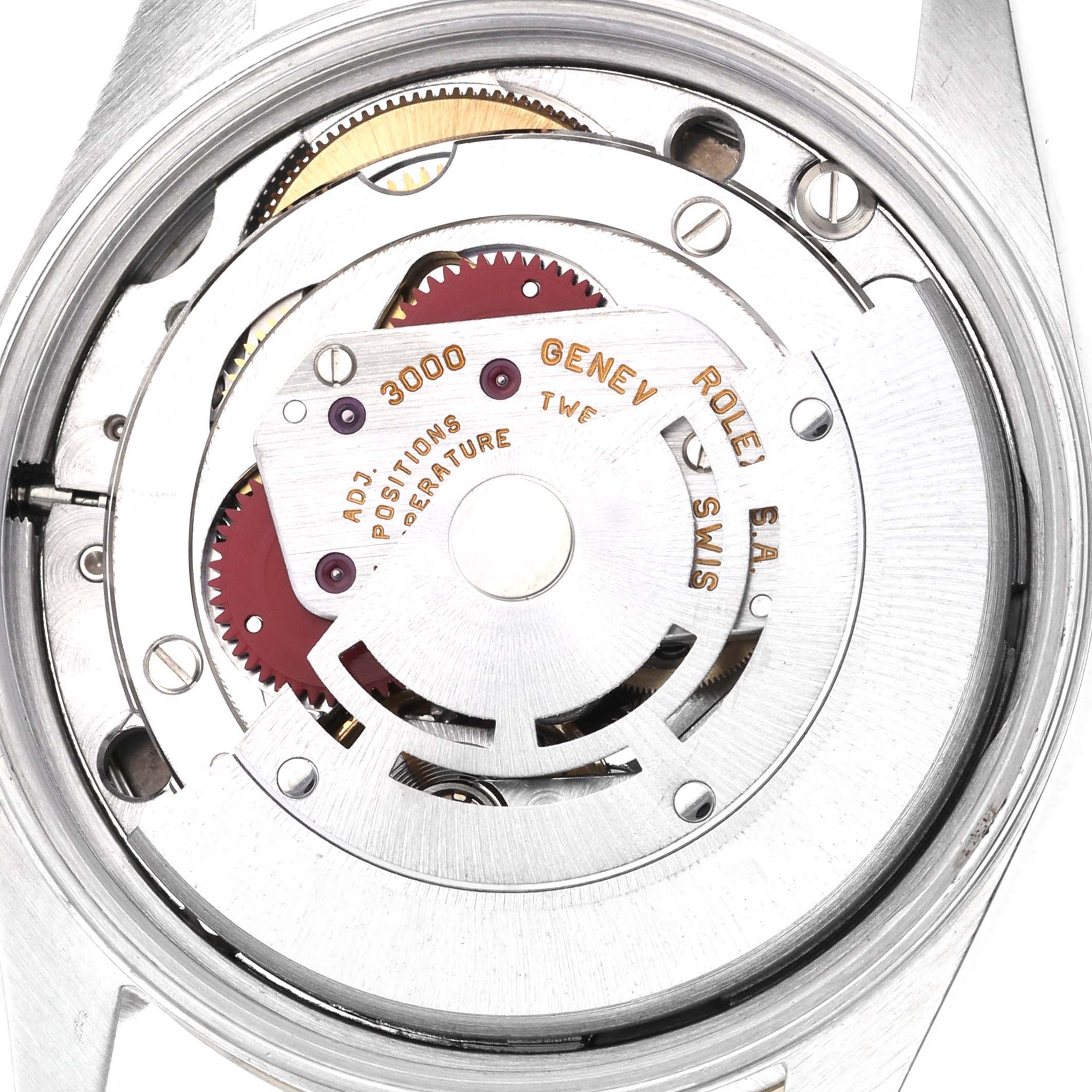 The image shows the movement of a Rolex Oyster Perpetual 14233 Men's Steel and Gold (two tone) Silver Dial 14233 Men's Steel and Gold (two tone) Silver Dial watch from a top-down angle.
