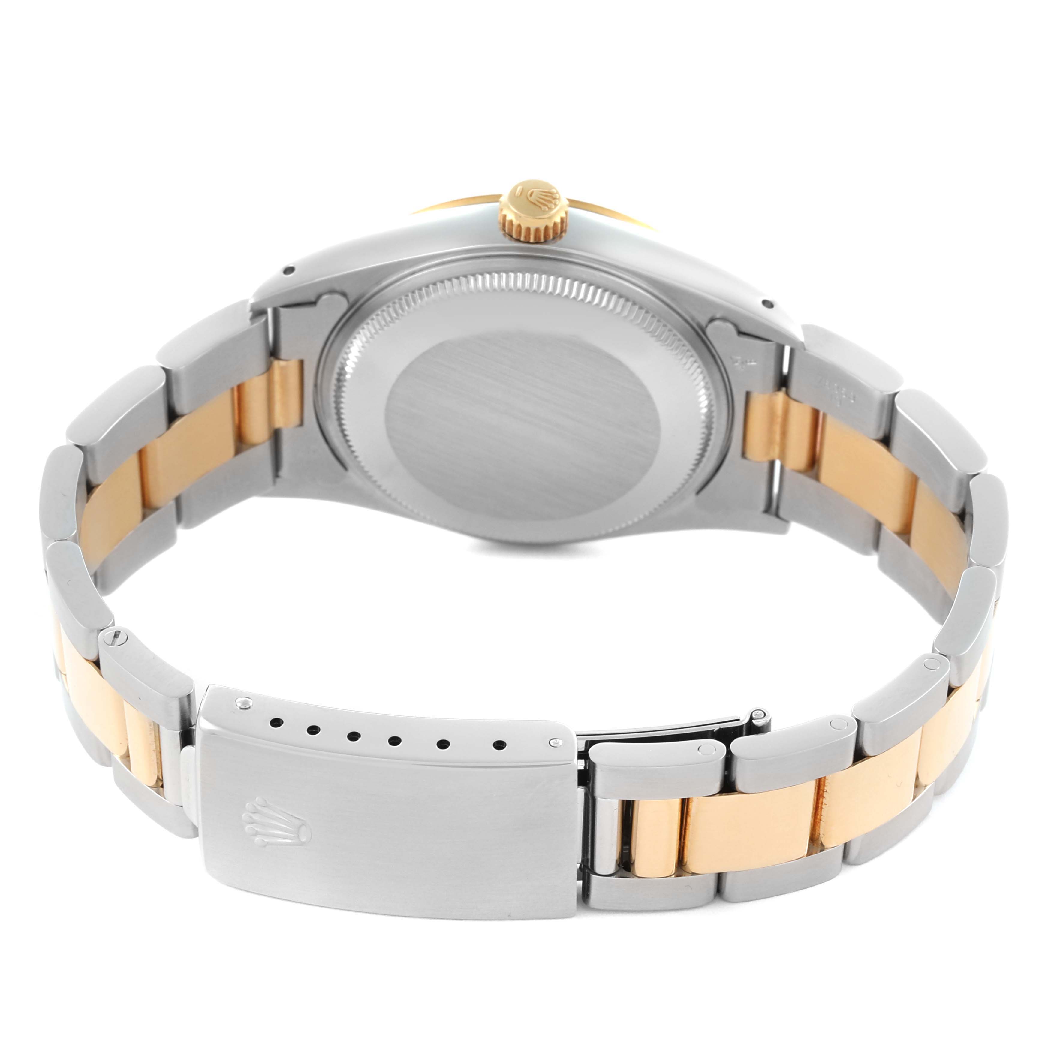 The image shows the back of the Rolex Oyster Perpetual 14233 Men's Steel and Gold (two tone) Silver Dial 14233 Men's Steel and Gold (two tone) Silver Dial watch, highlighting the case back, bracelet, and clasp.