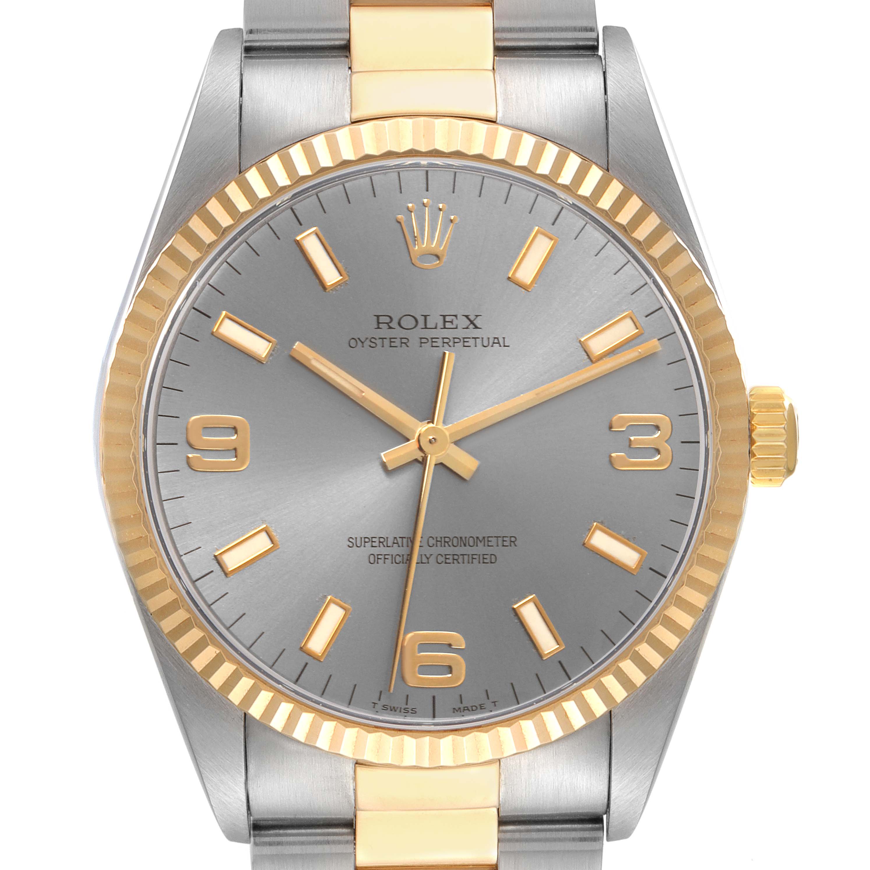 The Rolex Oyster Perpetual 14233 Men's Steel and Gold (two tone) Silver Dial 14233 Men's Steel and Gold (two tone) Silver Dial watch is shown from a front angle, highlighting its dial, bezel, and part of the bracelet.