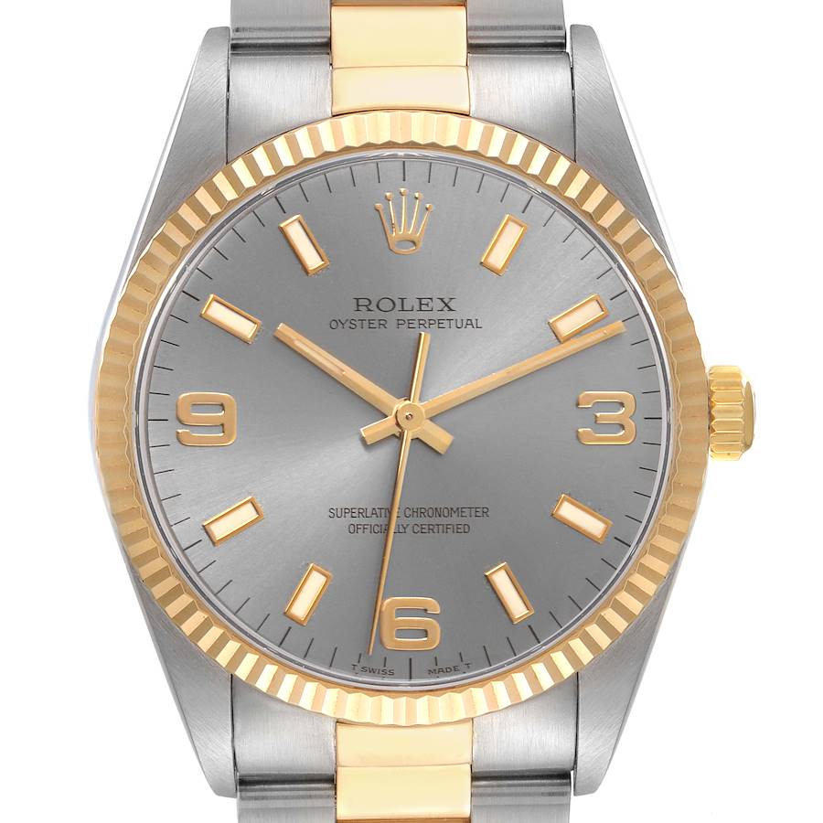 The Rolex Oyster Perpetual watch is shown from a front angle, highlighting its dial, bezel, and part of the bracelet.