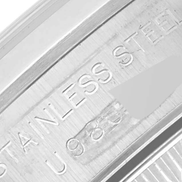 This image shows a close-up of the case side engraving reading "STAINLESS STEEL" on a Rolex Oyster Perpetual 67180 Women's Stainless Steel Black Dial 67180 Women's Stainless Steel Black Dial watch.