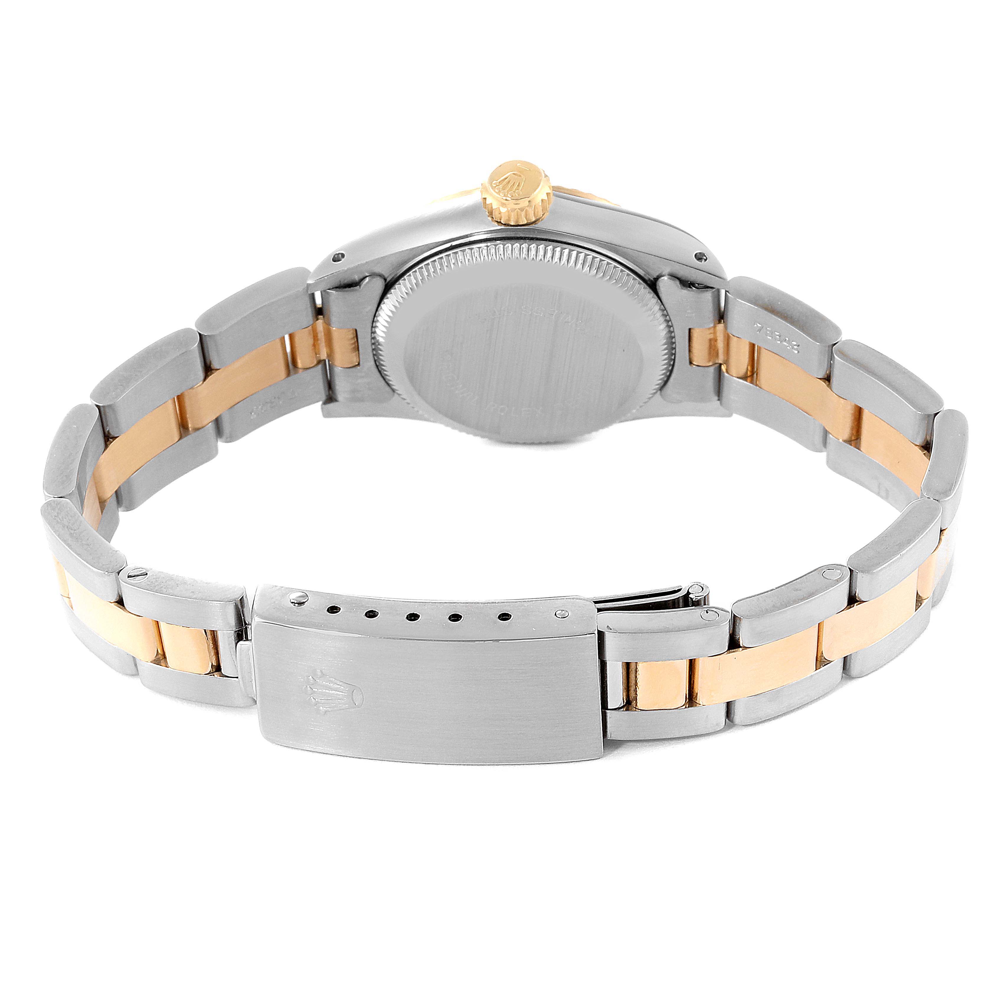The image shows the back and bracelet of a Rolex Oyster Perpetual 67193 Women's Steel and Gold (two tone) Champagne Dial 67193 Women's Steel and Gold (two tone) Champagne Dial watch, featuring a gold accent and stainless steel clasp.