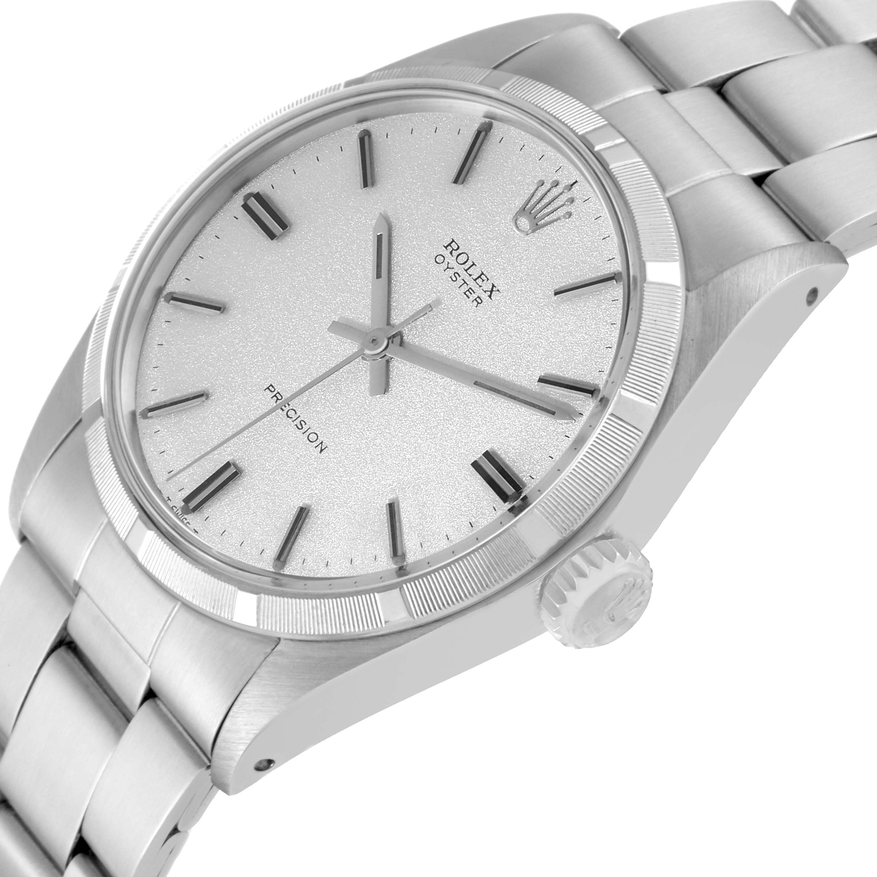 The image shows a close-up of the Rolex Vintage Collection 6427 Men's Stainless Steel Silver Dial 6427 Men's Stainless Steel Silver Dial model's face, bezel, and part of the metal bracelet, viewed from an angle.