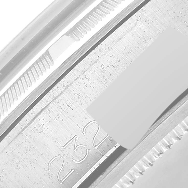 This close-up image of the Vintage Collection model by Rolex shows the side of the case with part of the serial number engraved.