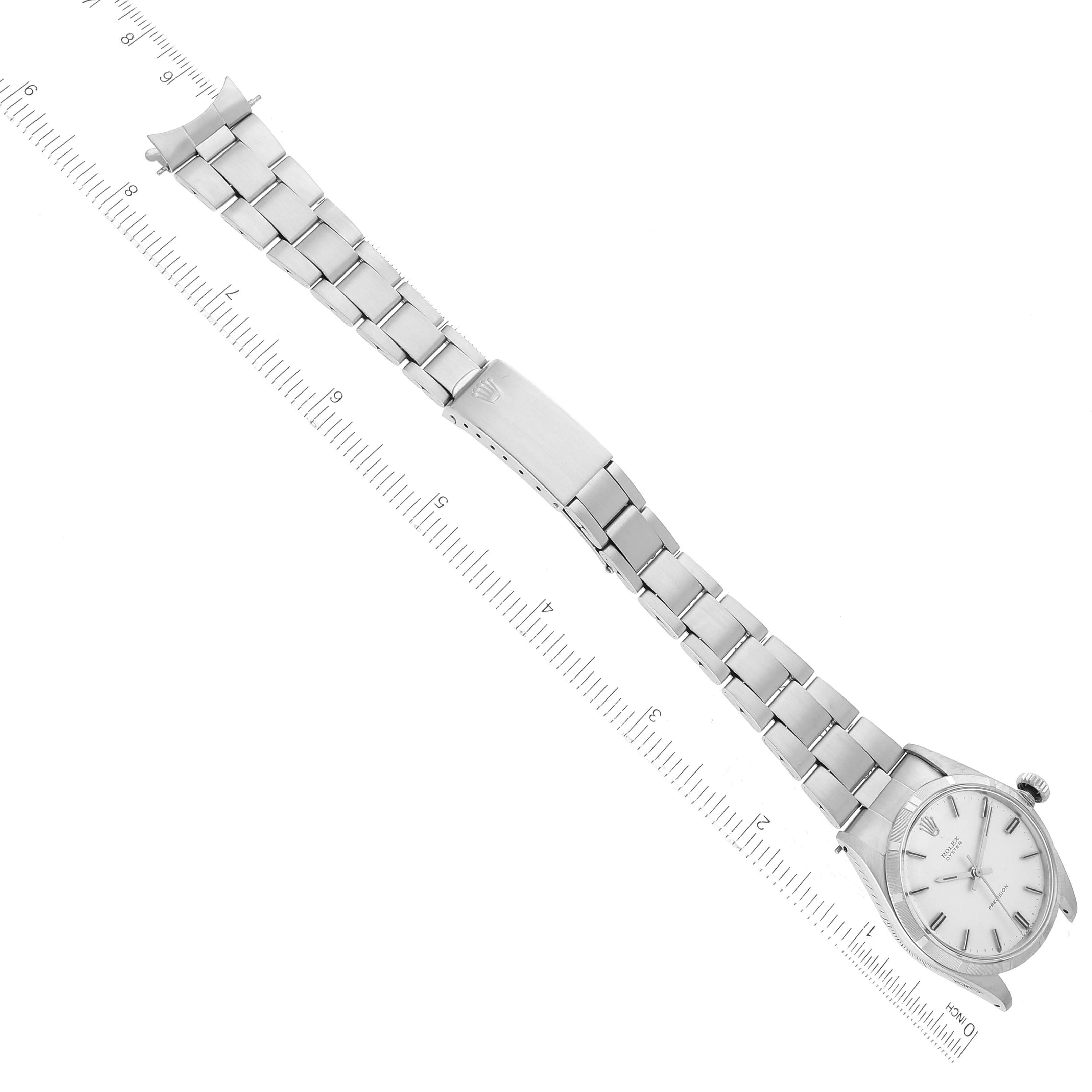 The image shows a full view of a Rolex Vintage Collection 6427 Men's Stainless Steel Silver Dial 6427 Men's Stainless Steel Silver Dial watch lying flat with a ruler for scale.