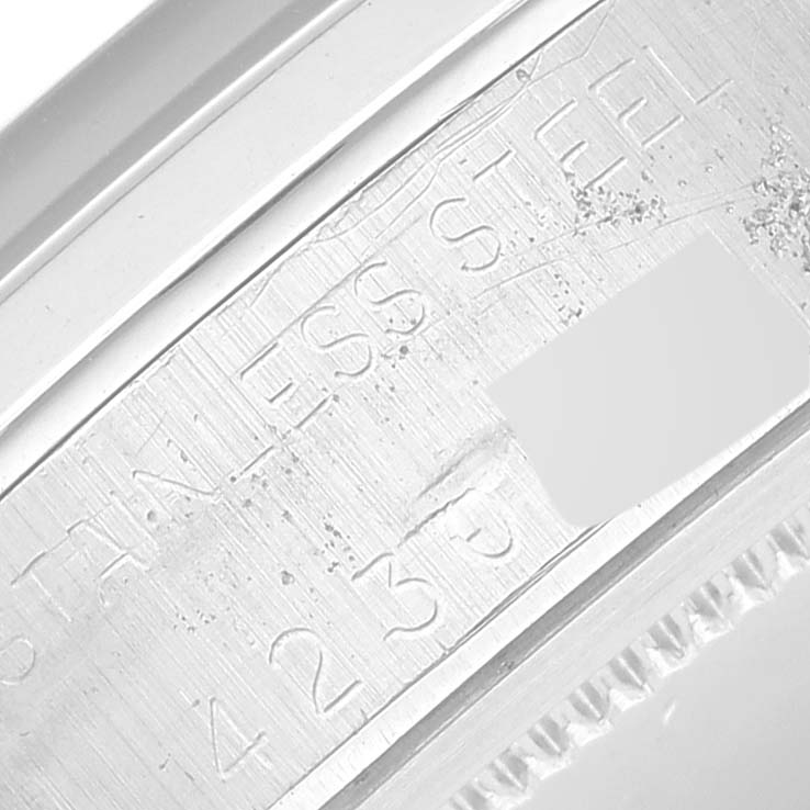 The image shows a close-up of the engraved text on the stainless steel case back of a Vintage Collection Rolex watch.