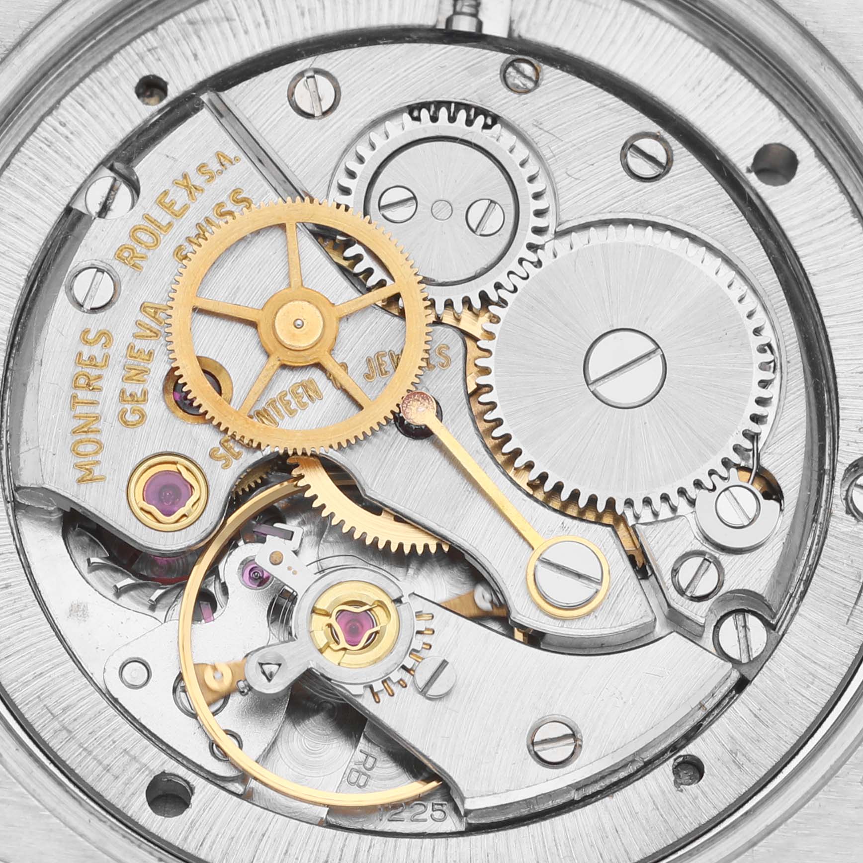 This image shows a close-up of the internal mechanical movement and gears of a Vintage Collection model by Rolex.