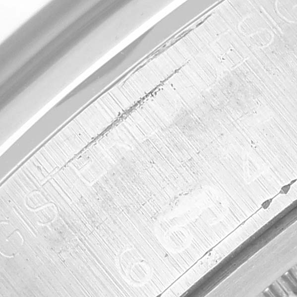 This close-up image shows the engraved inner ring of the Rolex Vintage Collection 6694 Men's Stainless Steel Blue Dial 6694 Men's Stainless Steel Blue Dial watch.