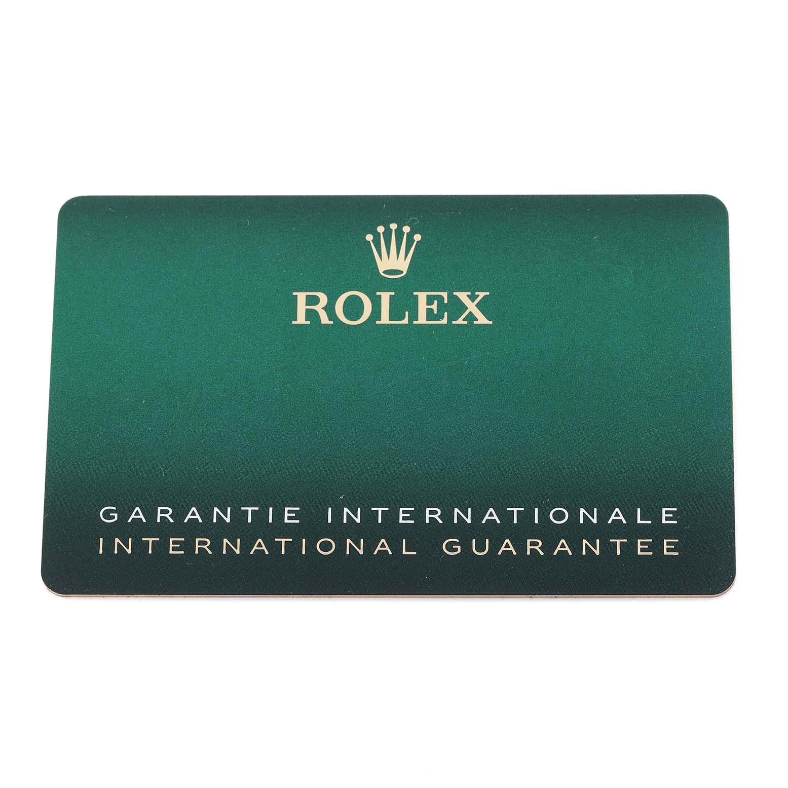 The image shows a green Rolex international guarantee card for the Pearlmaster model.
