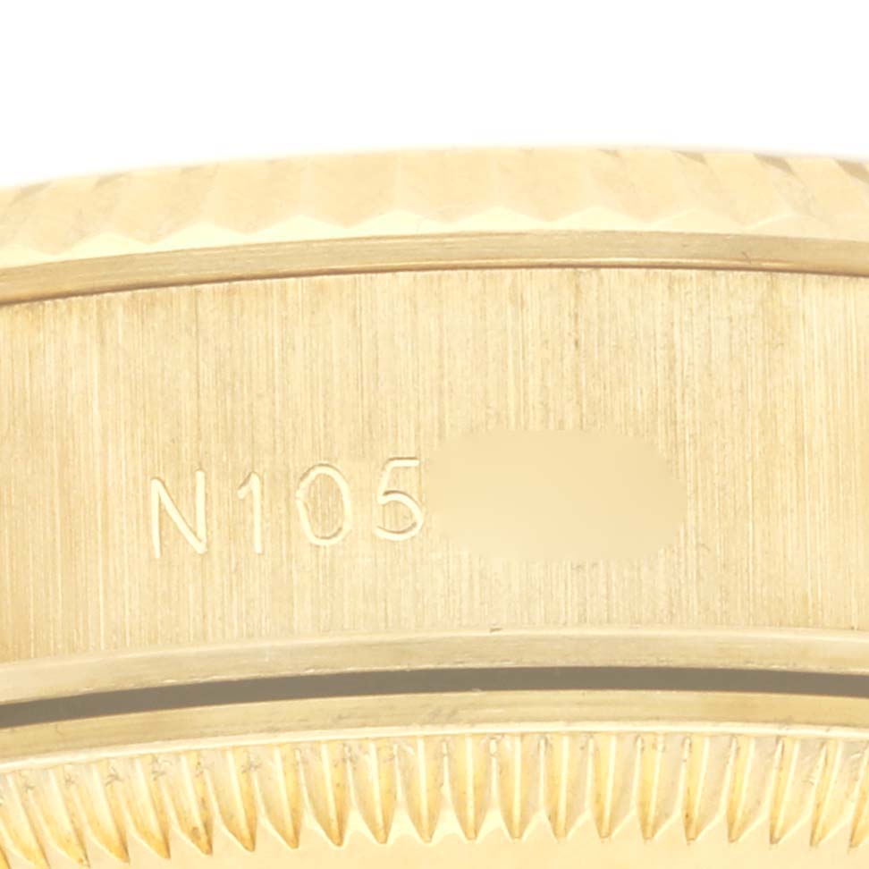 The image shows a close-up of the case side and part of the bezel of a Rolex President 69178 Women's Yellow Gold Champagne Dial 69178 Women's Yellow Gold Champagne Dial watch, highlighting the engraved serial number.