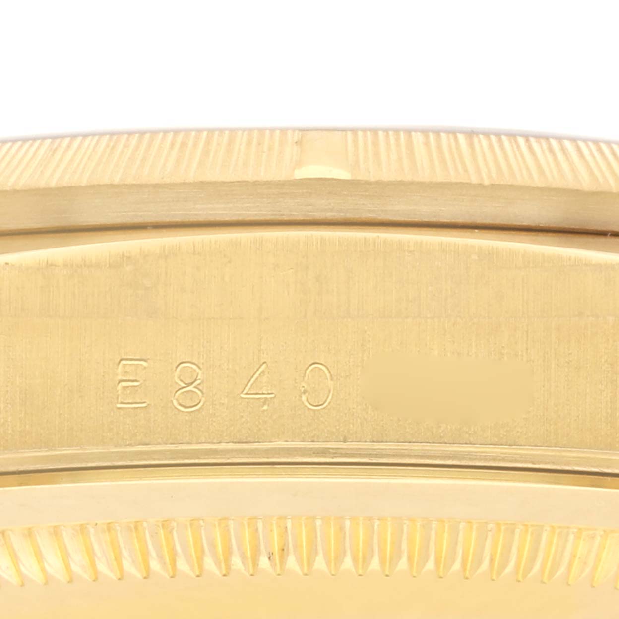 The image shows a close-up of the Rolex President 18248 Men's Yellow Gold Champagne Dial 18248 Men's Yellow Gold Champagne Dial model, focusing on the edge of the bezel and case with engraved details.