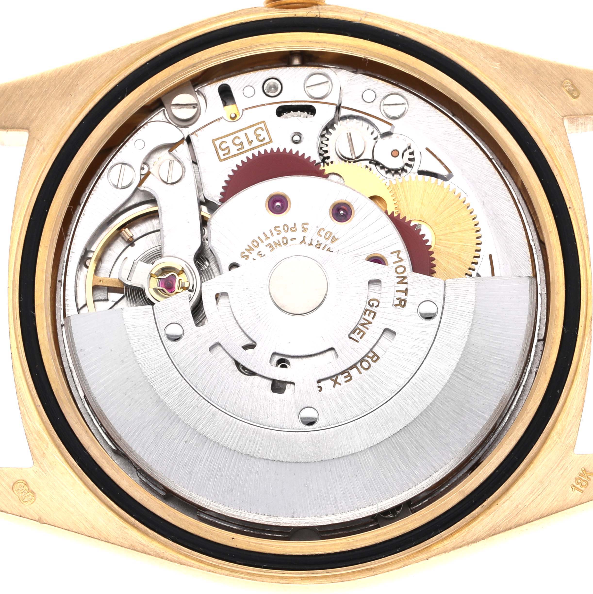 The image shows the movement of the Rolex President 18248 Men's Yellow Gold Champagne Dial 18248 Men's Yellow Gold Champagne Dial watch from the back, highlighting gears and the rotor.