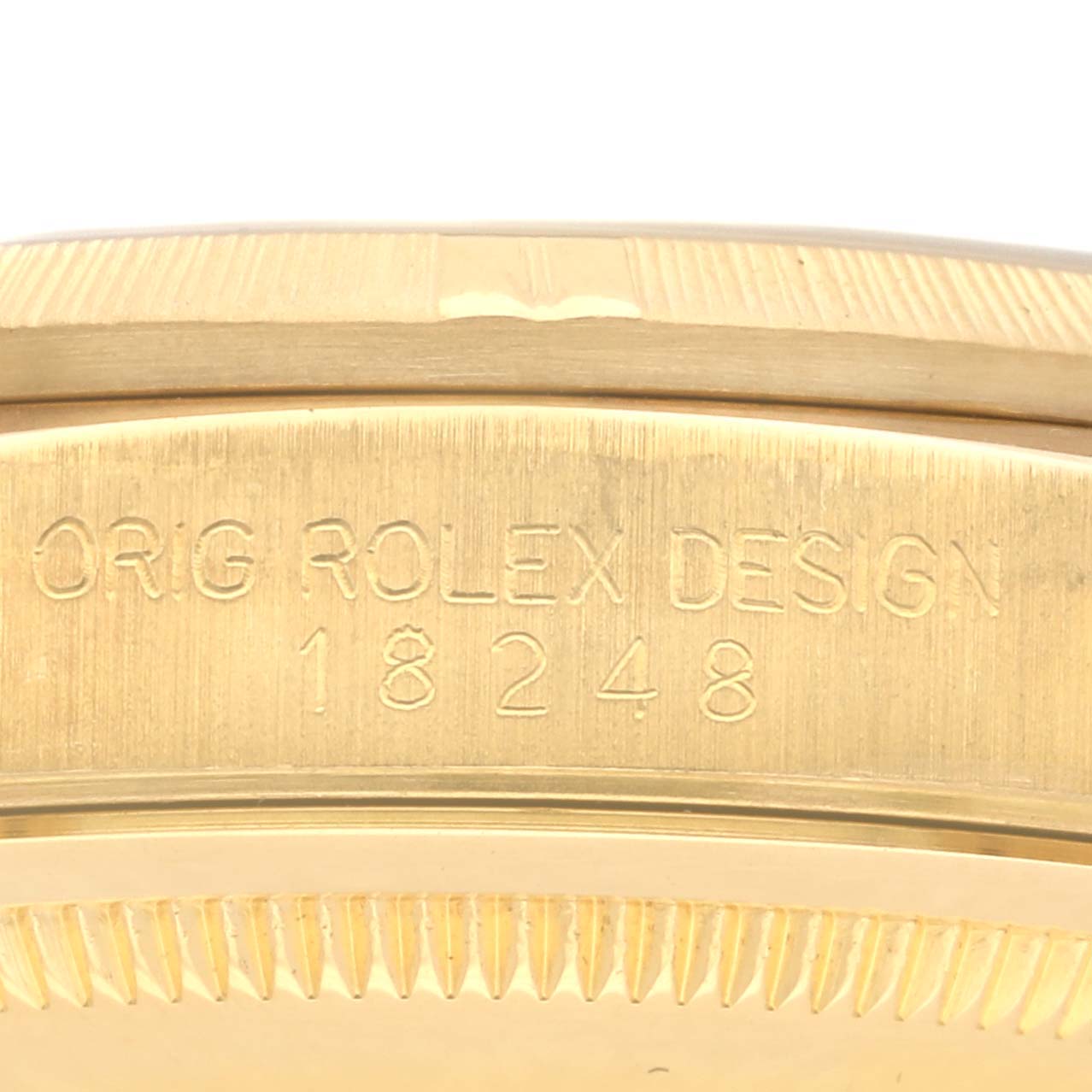 The image shows the side of a Rolex President 18248 Men's Yellow Gold Champagne Dial 18248 Men's Yellow Gold Champagne Dial model, focusing on the engraved model number.