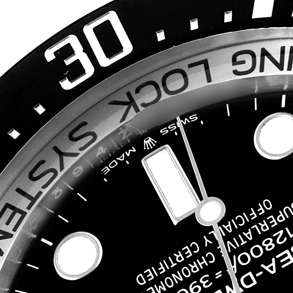 The image shows a close-up of the bezel and dial with text of a Rolex Sea-Dweller 126660 Men
s Stainless Steel Black Dial 126660 Men
s Stainless Steel Black Dial watch at an angled view.