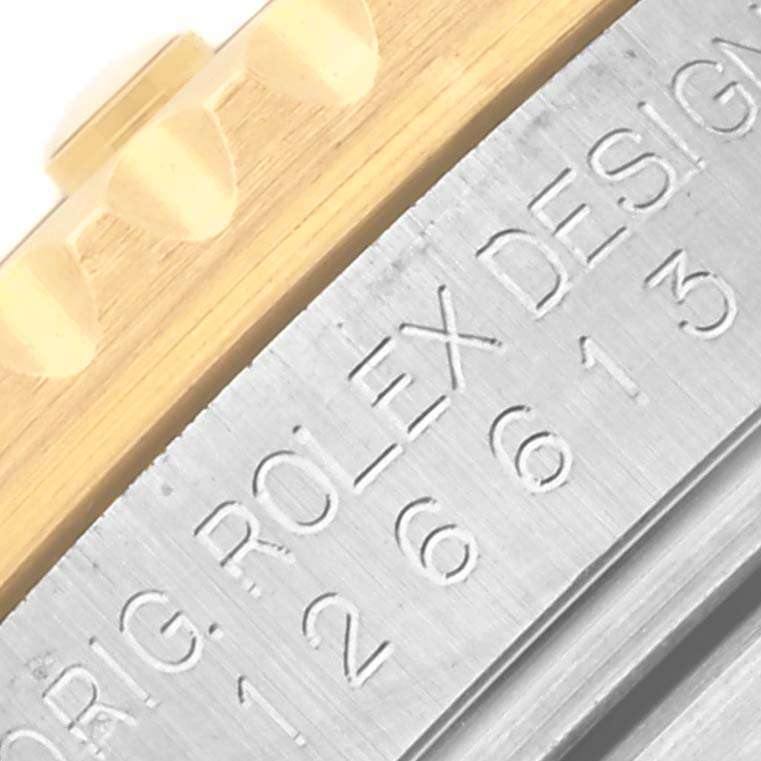 The image shows a close-up of the bezel and engraved details on a Rolex Submariner 126613LB Men's Steel and Gold (two tone) Blue Dial 126613LB Men's Steel and Gold (two tone) Blue Dial watch.