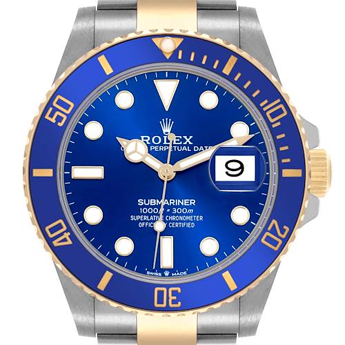 The Rolex Submariner watch is shown from the front, highlighting its blue dial, bezel, and gold accents.