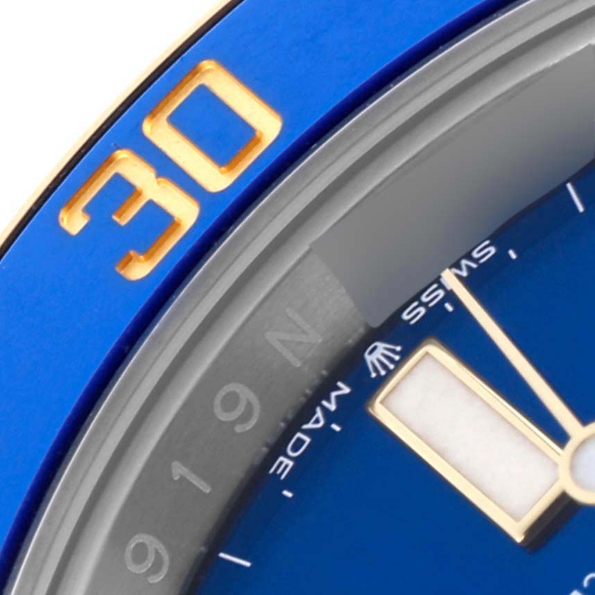 The image shows a close-up of the bezel, dial edge, and minute hand of a Rolex Submariner 126613LB Men's Steel and Gold (two tone) Blue Dial 126613LB Men's Steel and Gold (two tone) Blue Dial, highlighting the "30" marker.