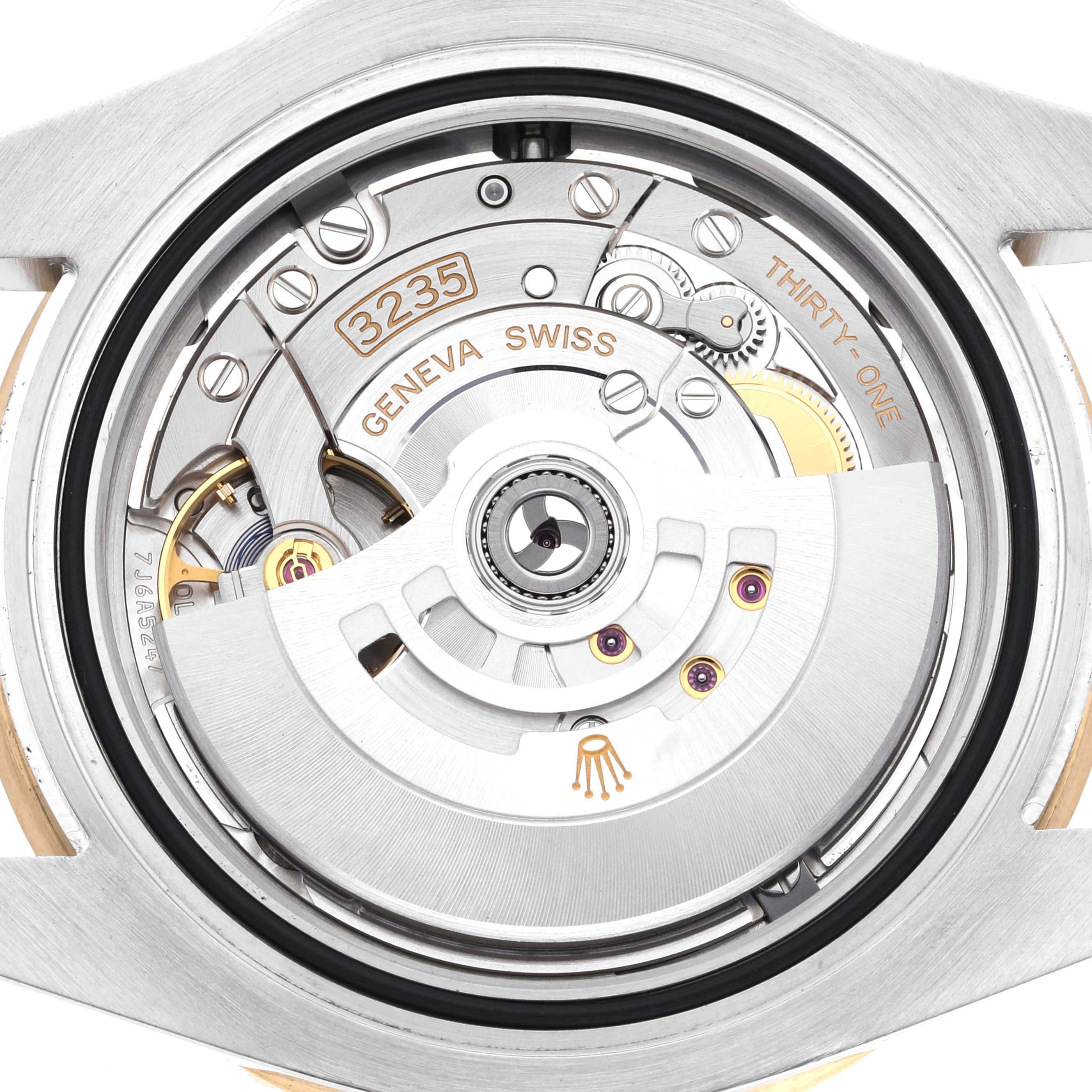 The image shows a close-up of the Rolex Submariner 126613LN Men's Steel and Gold (two tone) Black Dial 126613LN Men's Steel and Gold (two tone) Black Dial's movement, displaying the intricate mechanical components.