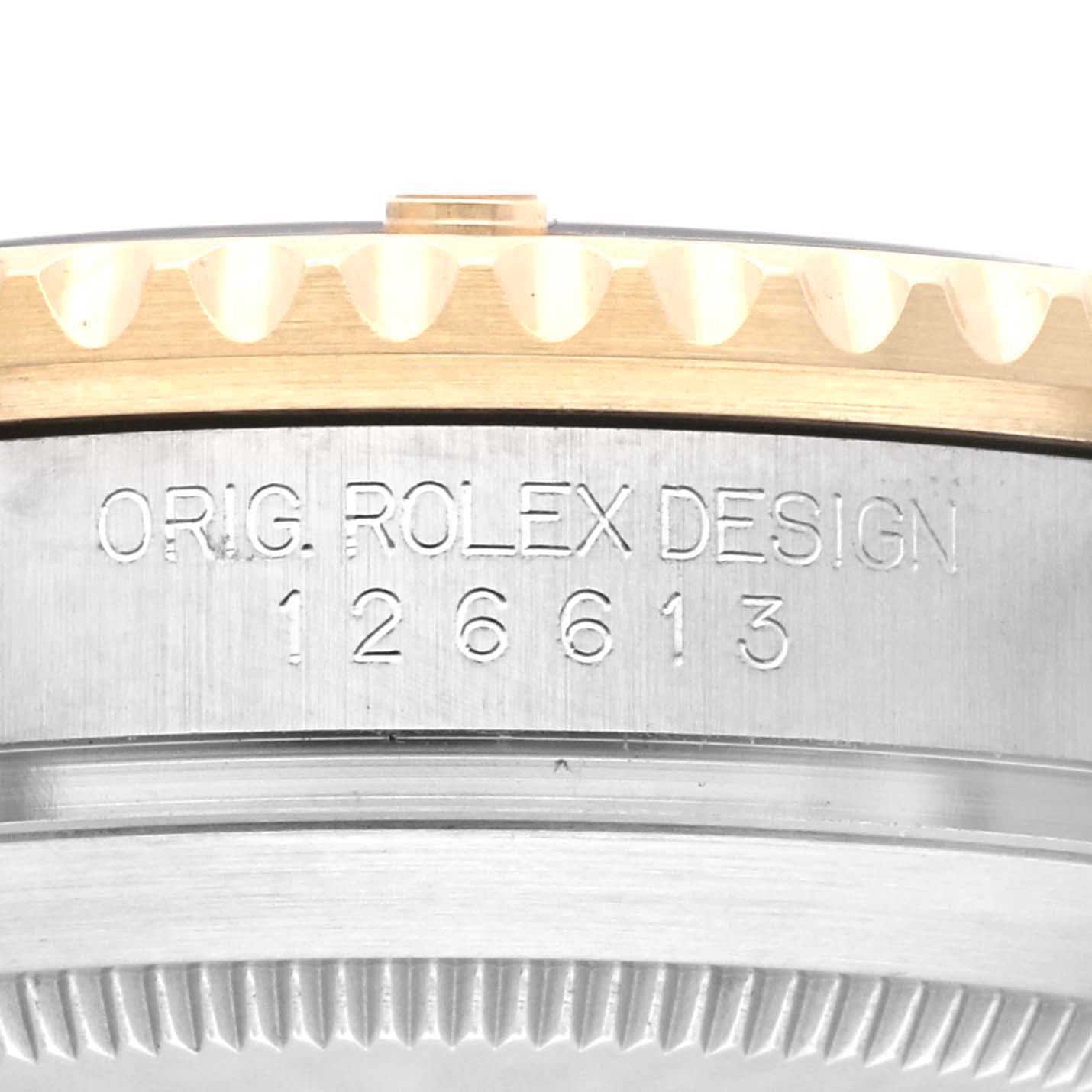 The image shows the edge and side of a Rolex Submariner 126613LN Men's Steel and Gold (two tone) Black Dial 126613LN Men's Steel and Gold (two tone) Black Dial watch, featuring the model number 126613 and the original Rolex design engraving.