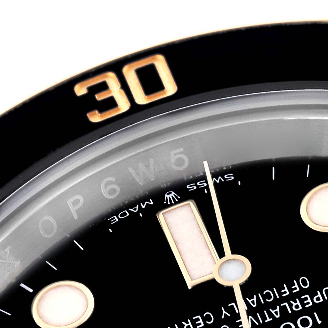 The image shows a close-up of the bezel, dial, and markers of a Rolex Submariner 126613LN Men's Steel and Gold (two tone) Black Dial 126613LN Men's Steel and Gold (two tone) Black Dial watch.