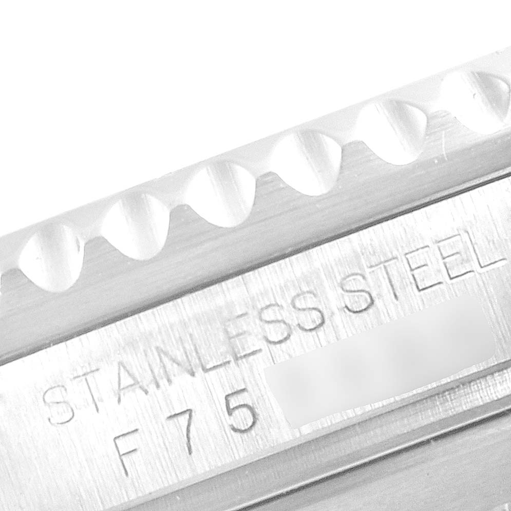 This image shows a close-up of the bezel and the stainless steel inscription on a Rolex Submariner 16610LV Men's Stainless Steel Black Dial 16610LV Men's Stainless Steel Black Dial watch.