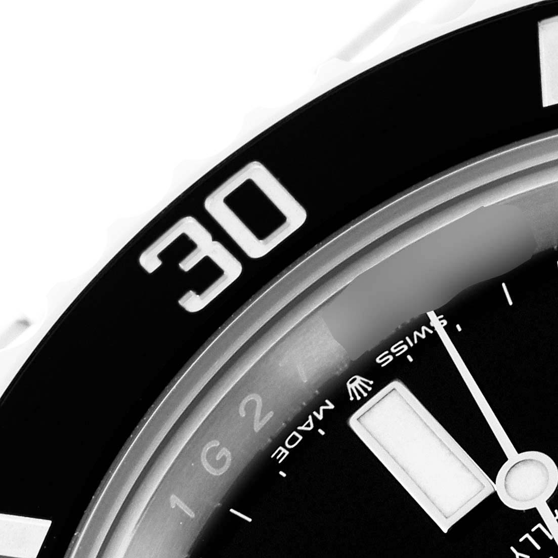 This close-up image of the Rolex Submariner 126610LN Men
s Stainless Steel Black Dial 126610LN Men
s Stainless Steel Black Dial watch shows the bezel with the "30" marker, part of the dial, and the minute hand.