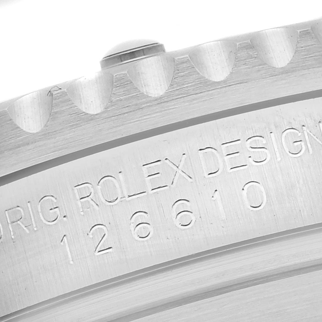 Close-up of the case side of a Rolex Submariner 126610LN Men
s Stainless Steel Black Dial 126610LN Men
s Stainless Steel Black Dial, showing the serial number and part of the bezel.