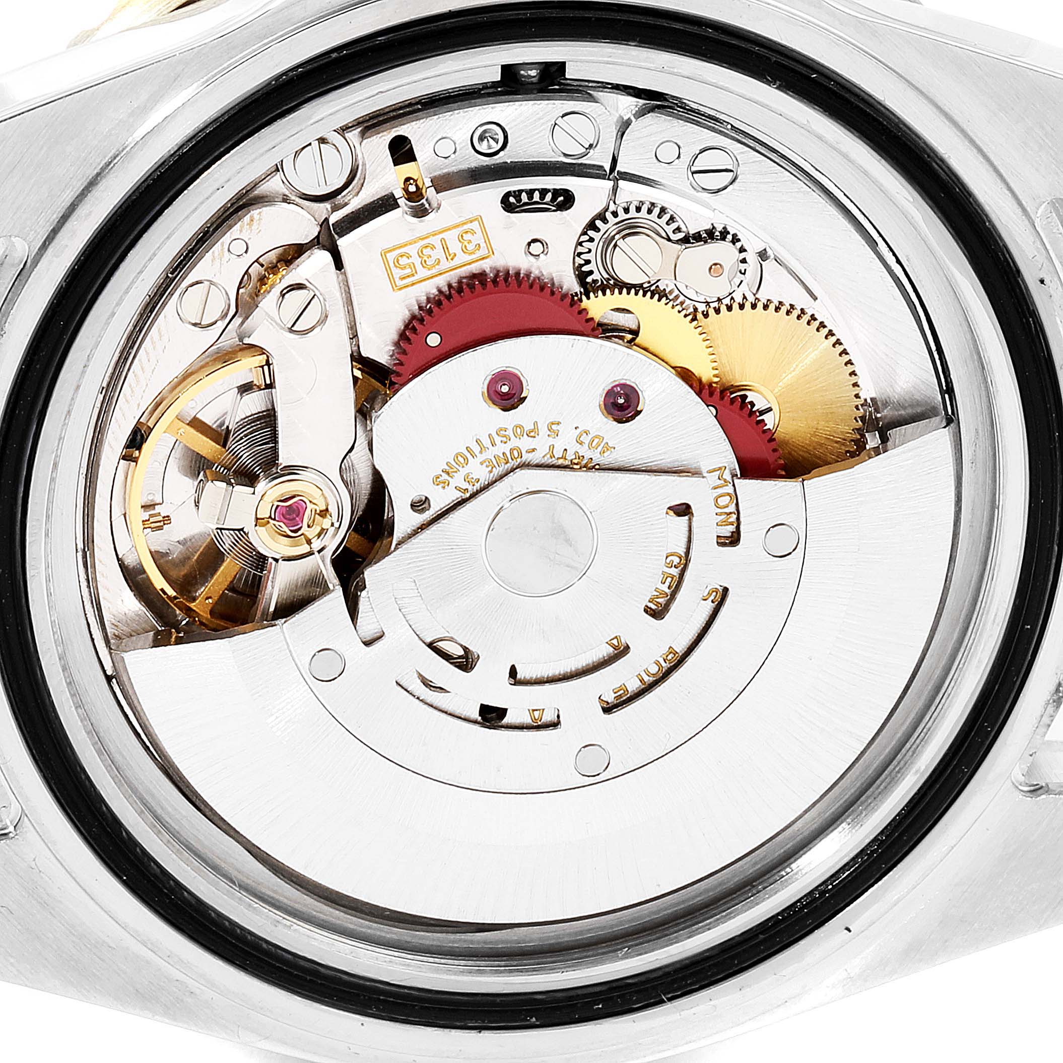 The image shows the internal movement mechanism of the Rolex Submariner 16613 Men's Steel and Gold (two tone) Blue Dial 16613 Men's Steel and Gold (two tone) Blue Dial watch from a back angle.