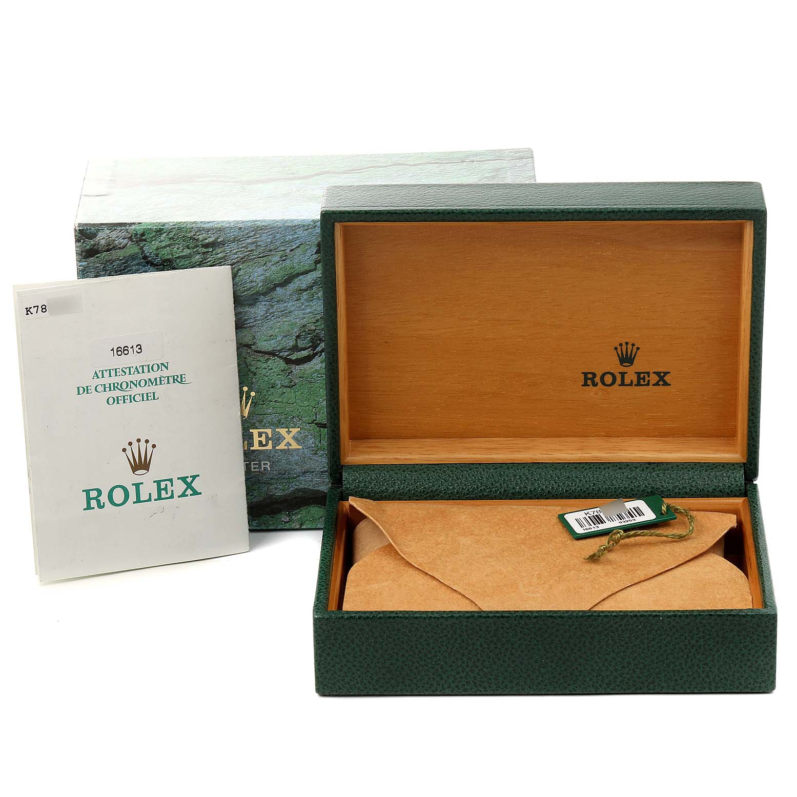 The image shows the packaging of a Rolex Submariner 16613 Men's Steel and Gold (two tone) Blue Dial 16613 Men's Steel and Gold (two tone) Blue Dial, including an open green and wooden box and the manual.