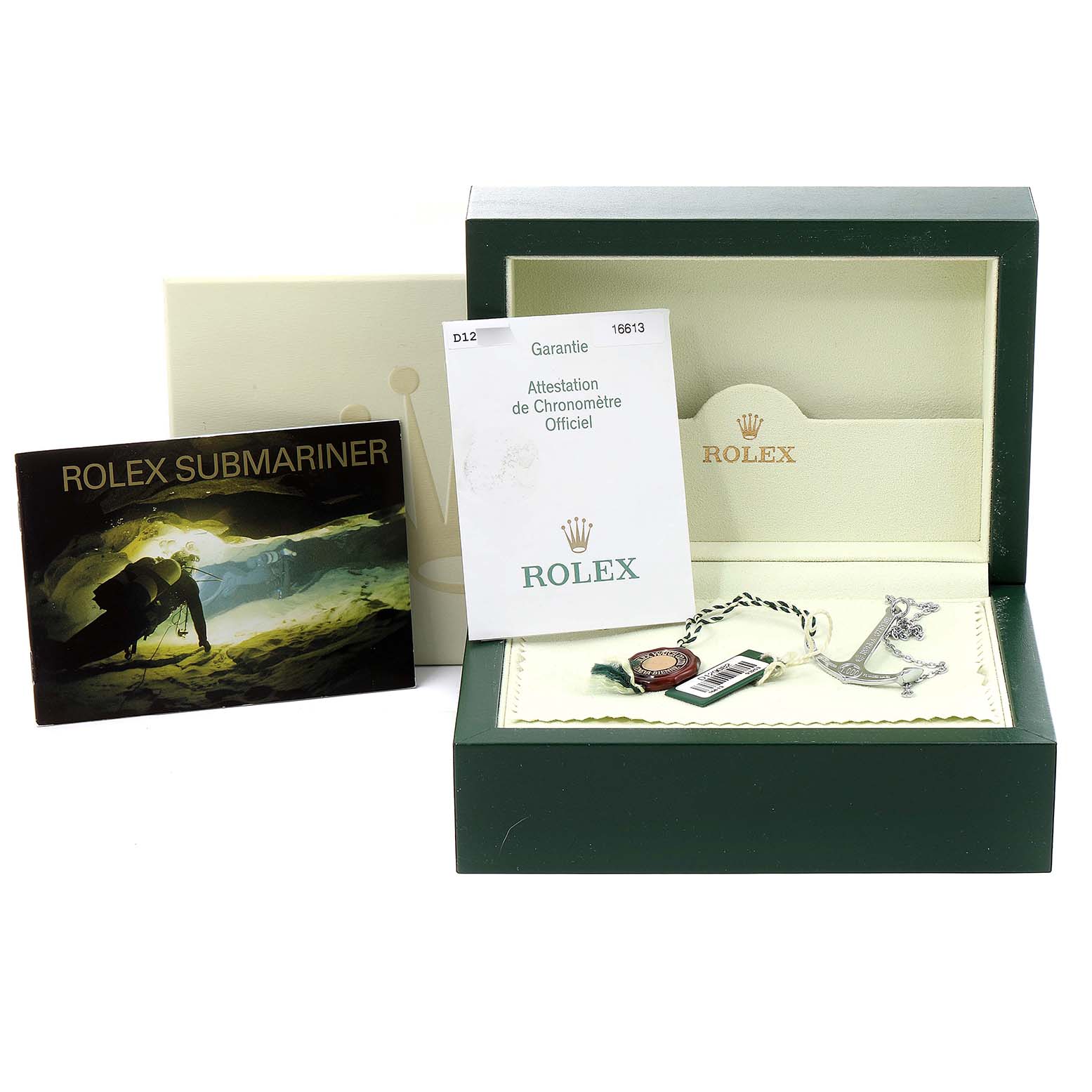 This image shows a Rolex Submariner 16613 Men's Steel and Gold (two tone) Blue Dial 16613 Men's Steel and Gold (two tone) Blue Dial box, warranty card, manual, and tags from a front-facing angle.