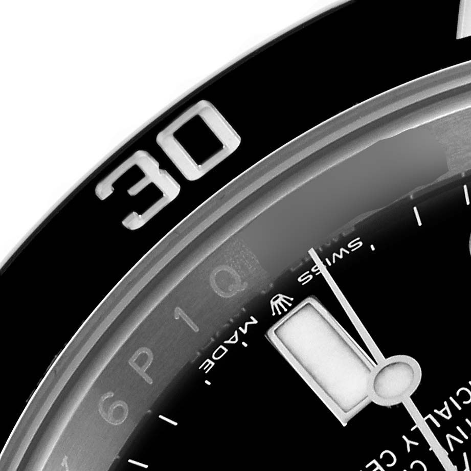 The image shows a close-up of the bezel and part of the dial on a Rolex Submariner 124060 Men's Stainless Steel Black Dial 124060 Men's Stainless Steel Black Dial watch, focusing on the 30-minute marker.