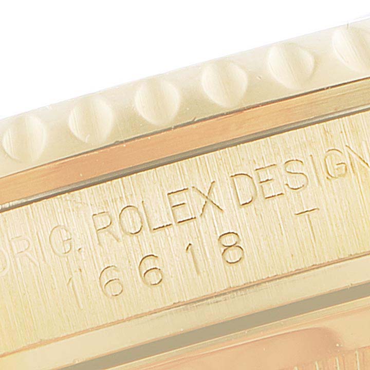 The image shows a close-up of the Rolex Submariner 16618 Men's Yellow Gold Blue Dial 16618 Men's Yellow Gold Blue Dial's engraved bezel and side with its model number 16618.