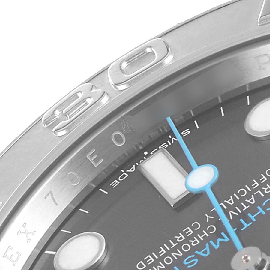 This close-up image of the Rolex Yacht-Master 116622 Men
s Stainless Steel Grey Dial 116622 Men
s Stainless Steel Grey Dial watch displays part of its bezel, dial, and luminous markers from an angled perspective.