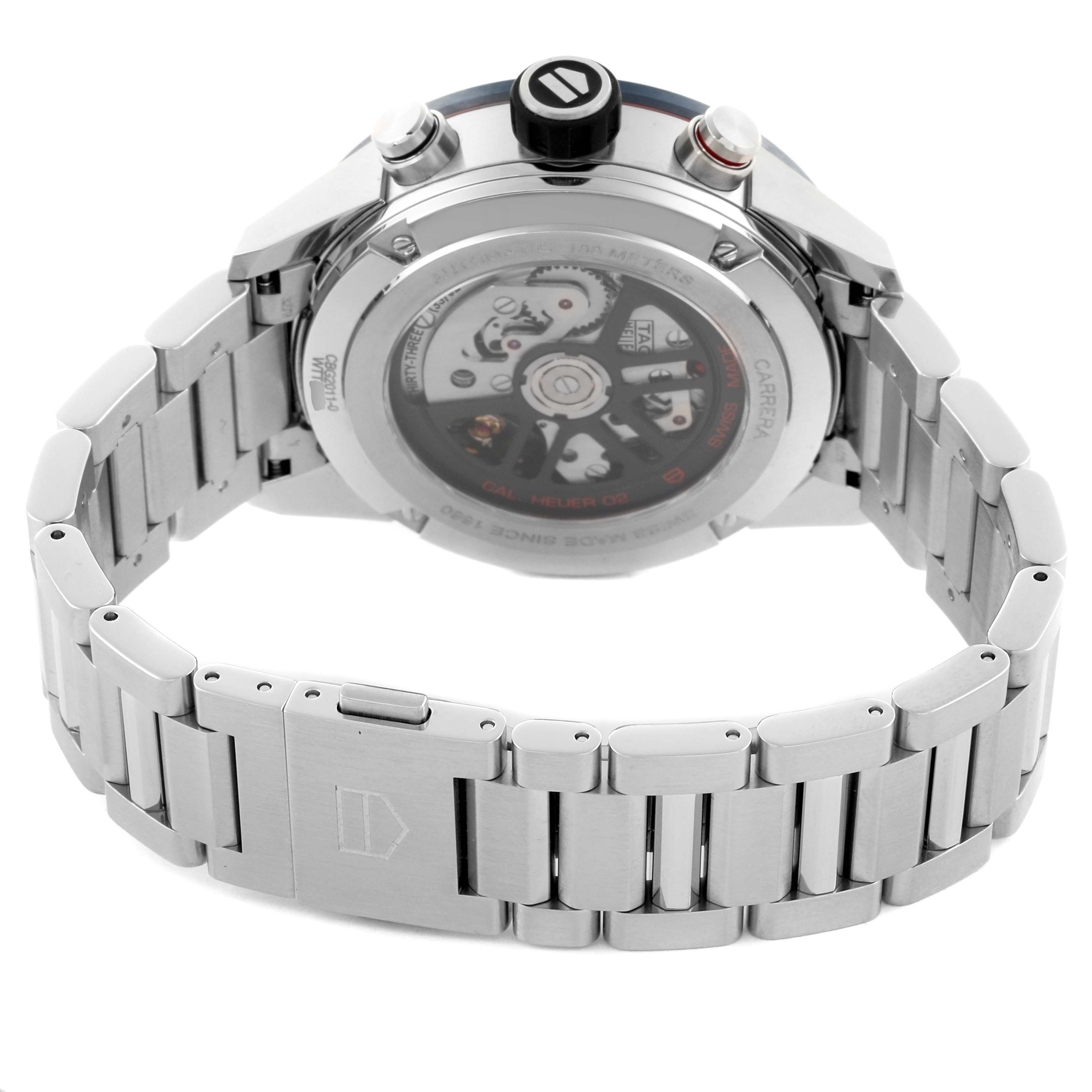 The Tag Heuer Carrera CBG2011 Men
s Stainless Steel Blue Dial CBG2011 Men
s Stainless Steel Blue Dial watch is shown from the rear, highlighting the transparent case back and metal bracelet.